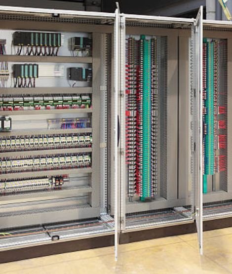Inside view of an automation control panel showing clean wiring and components